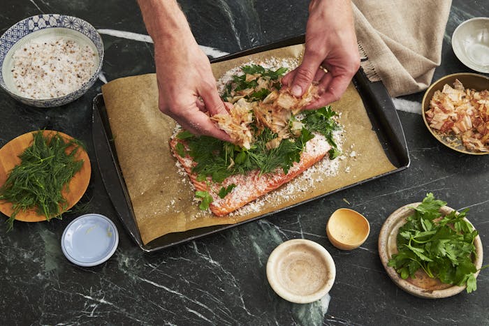 Chef preparing bonito-cured lox.