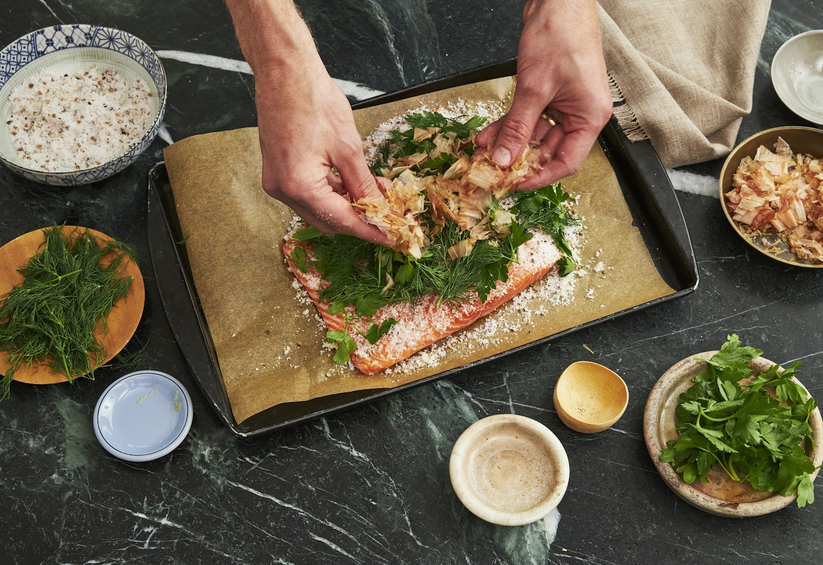 Chef preparing bonito-cured lox.