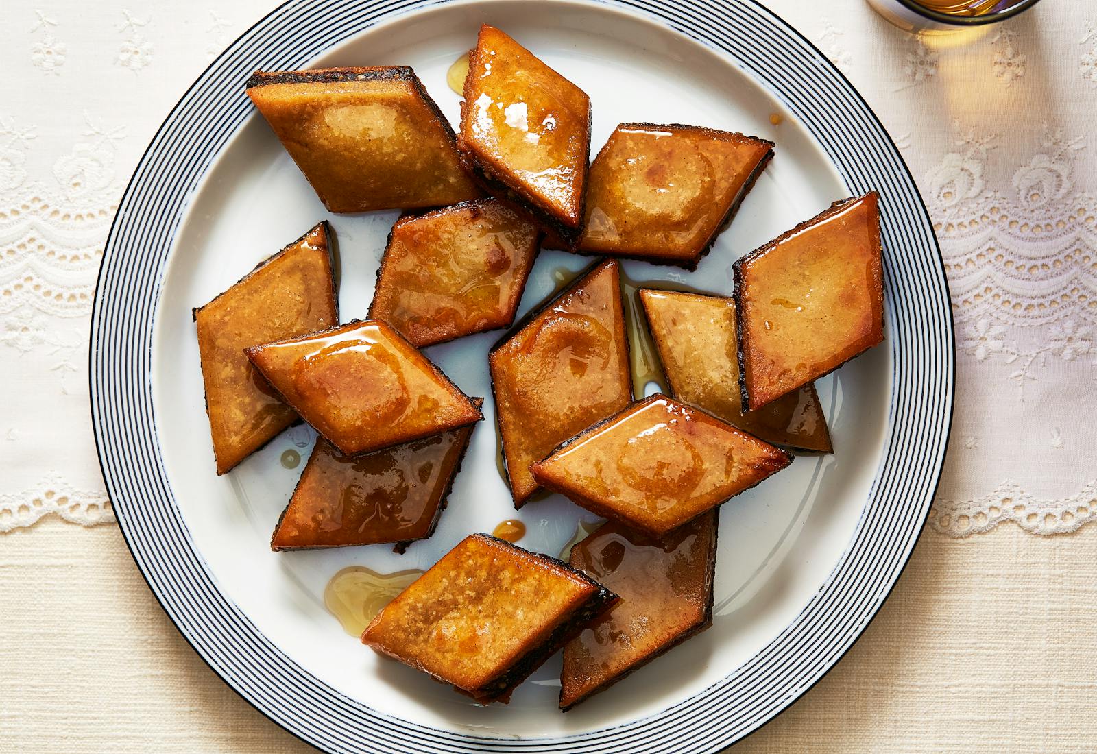 Makroud piled atop white plate.