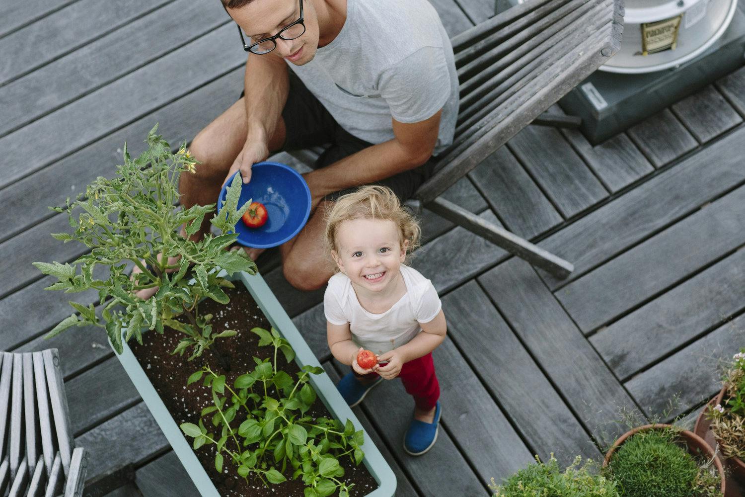 Idan and his daughter Ellie on their rooftop garden in the East Village.