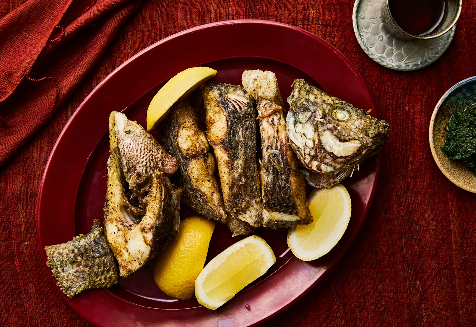 fried fish and lemon wedges on a plate
