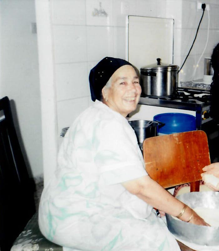 Esther preparing couscous in her kitchen in 1998.