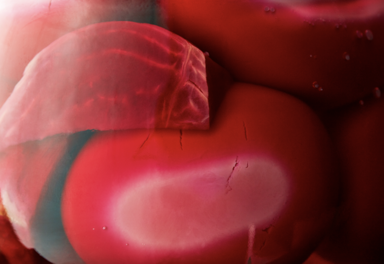 Closeup pickling jar with eggs and beets in pink brine.