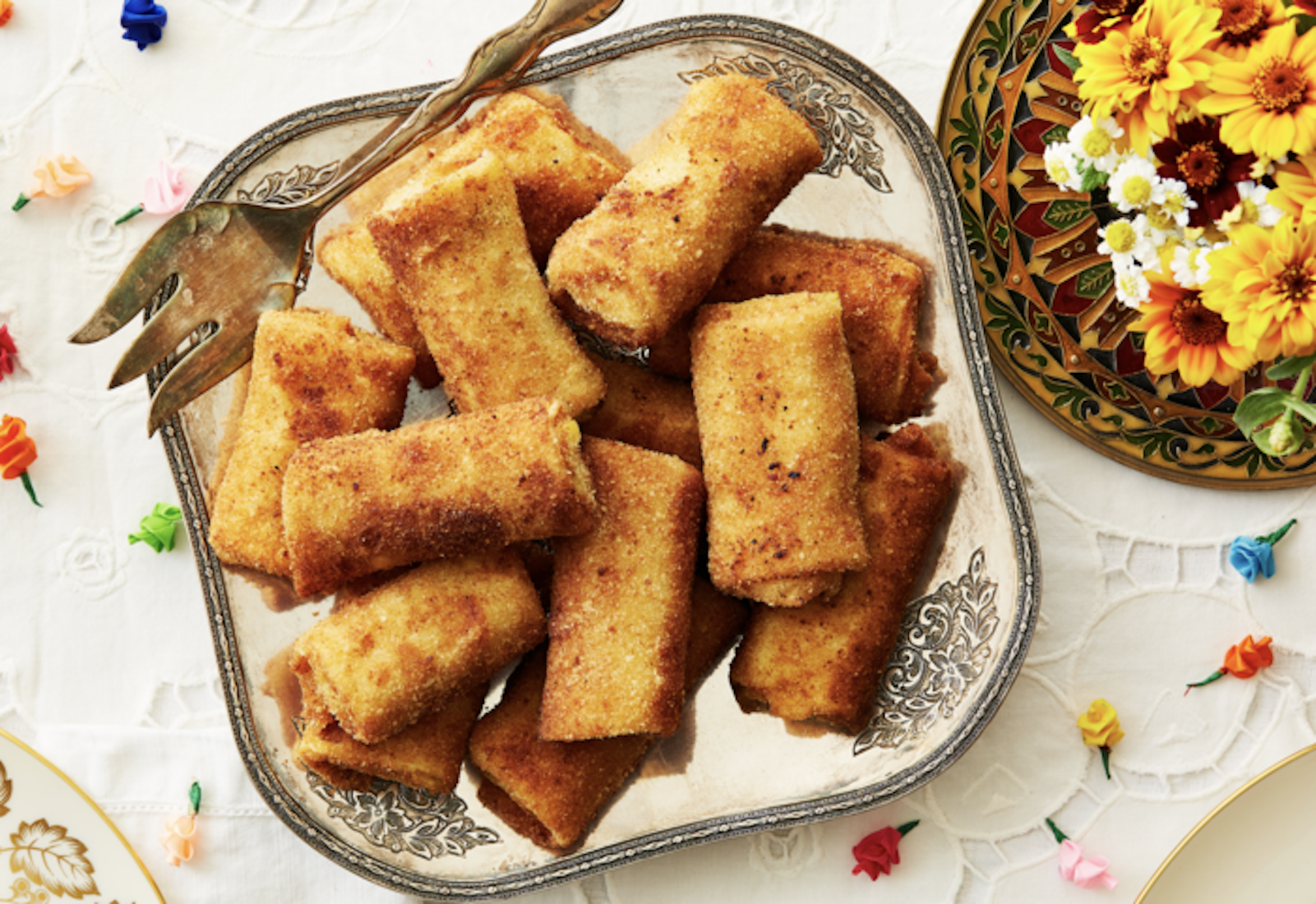 Pantras on silver serving platter, fresh flowers, colorful paper roses.