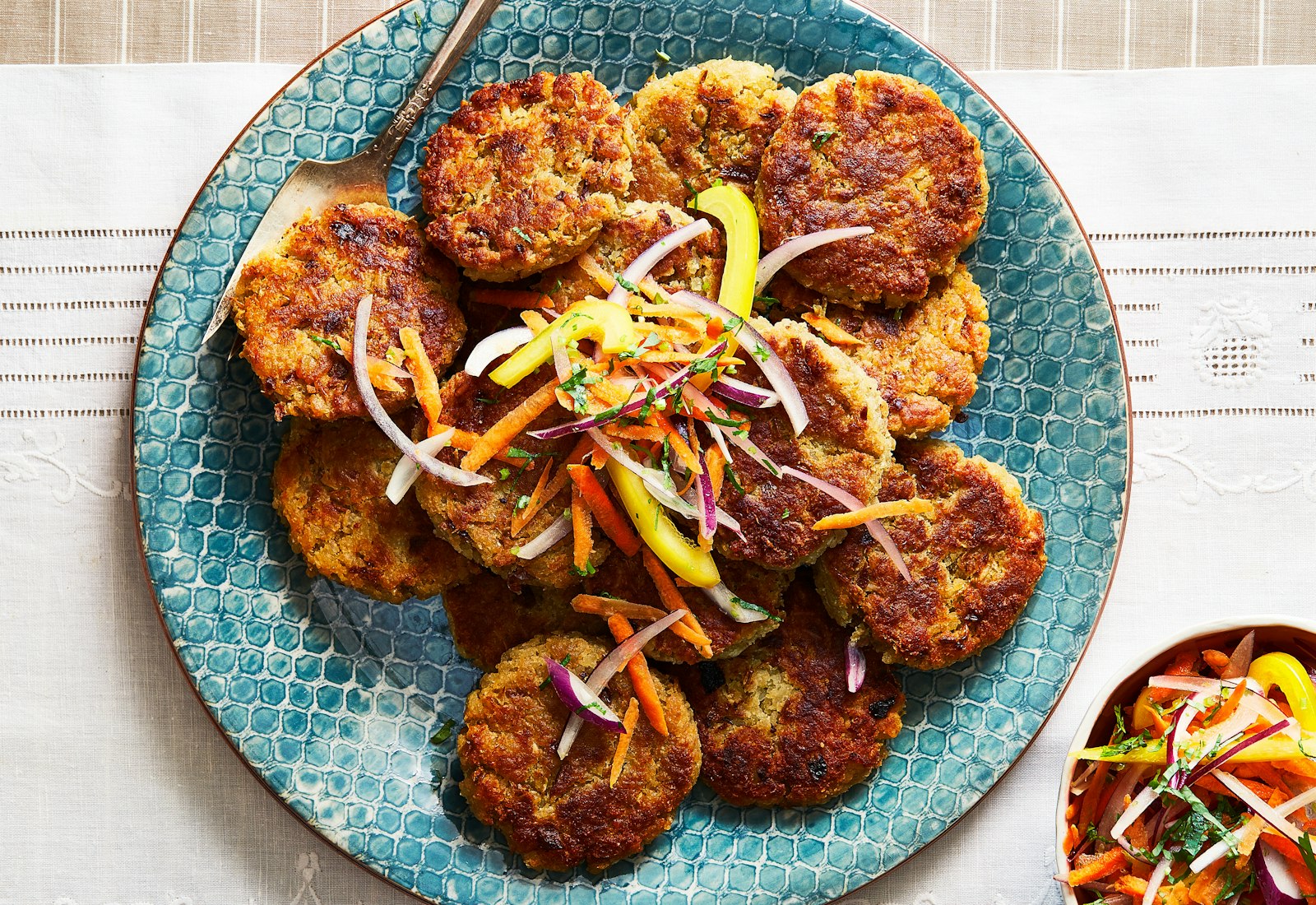 Tacu-Tacu with salsa criolla on a blue plate.