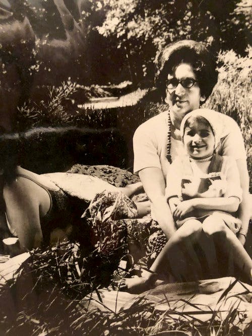 Sasha around age 7 with her Grandmother at a dacha right before they came to America.