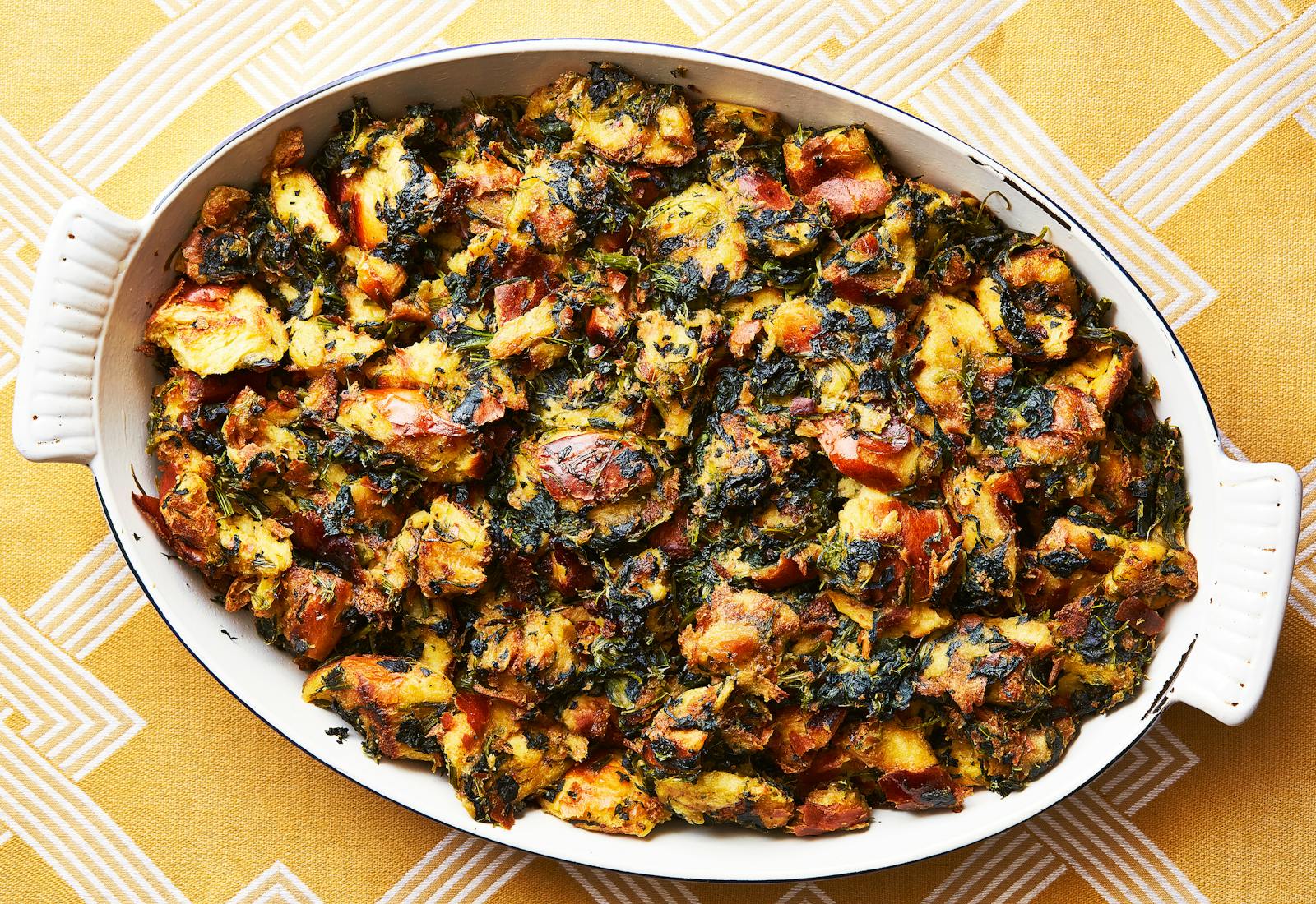 Spinach and challah stuffing in large serving dish.