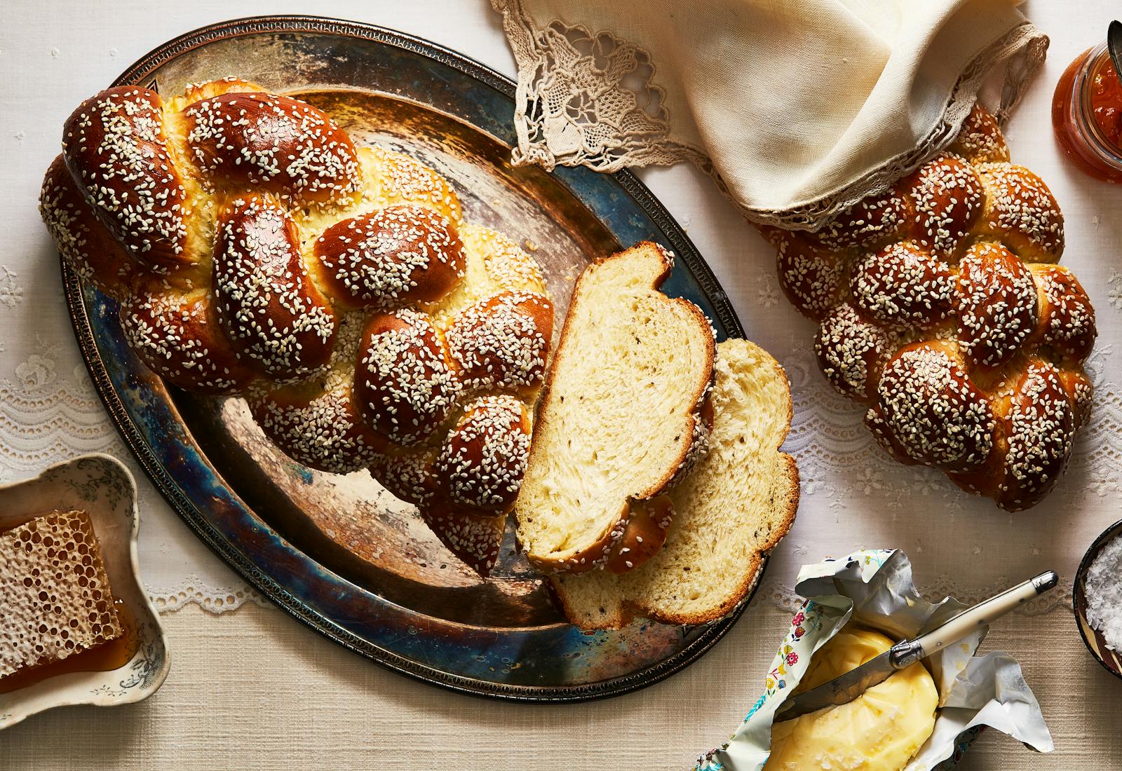 Anise seed challah with two slices on serving platter.