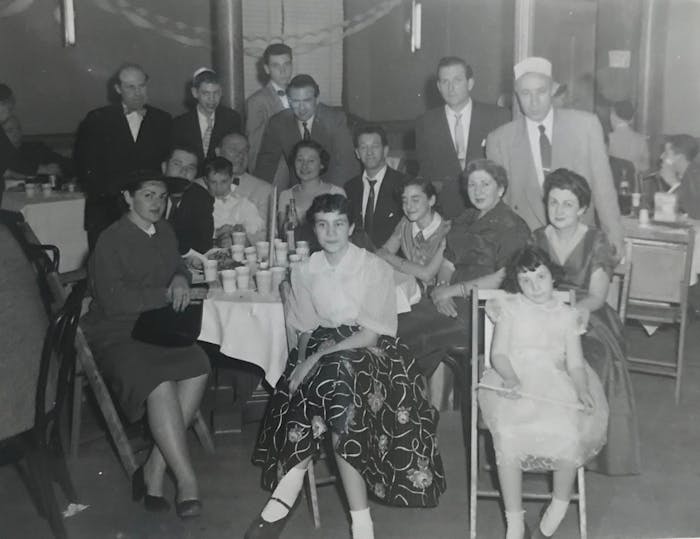 Family photo from cousin Arthur’s Bar Mitzvah, Queens, 1956. Jane is seated (front row all the way to the right) with Bertie seated directly behind her.