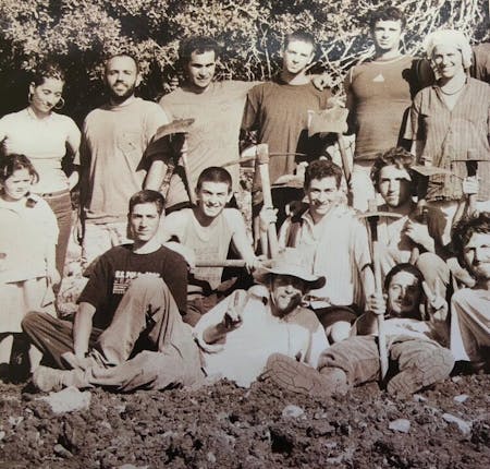 Loren (center left) pictured with his peers working on a farm in Yodfat in the 1990’s.