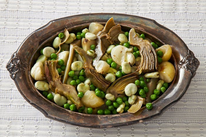 Vignarola in brown casserole dish.