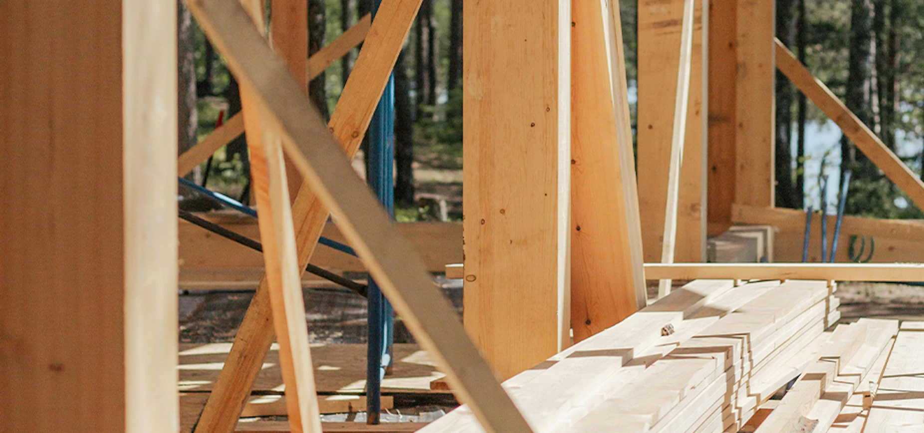 close up of house under construction showing beams and studs