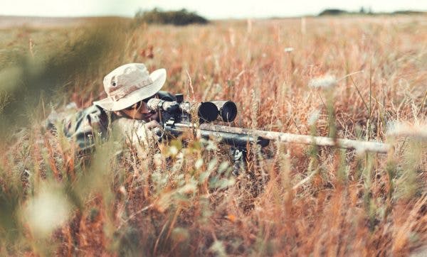 Hunter rifle stance in field