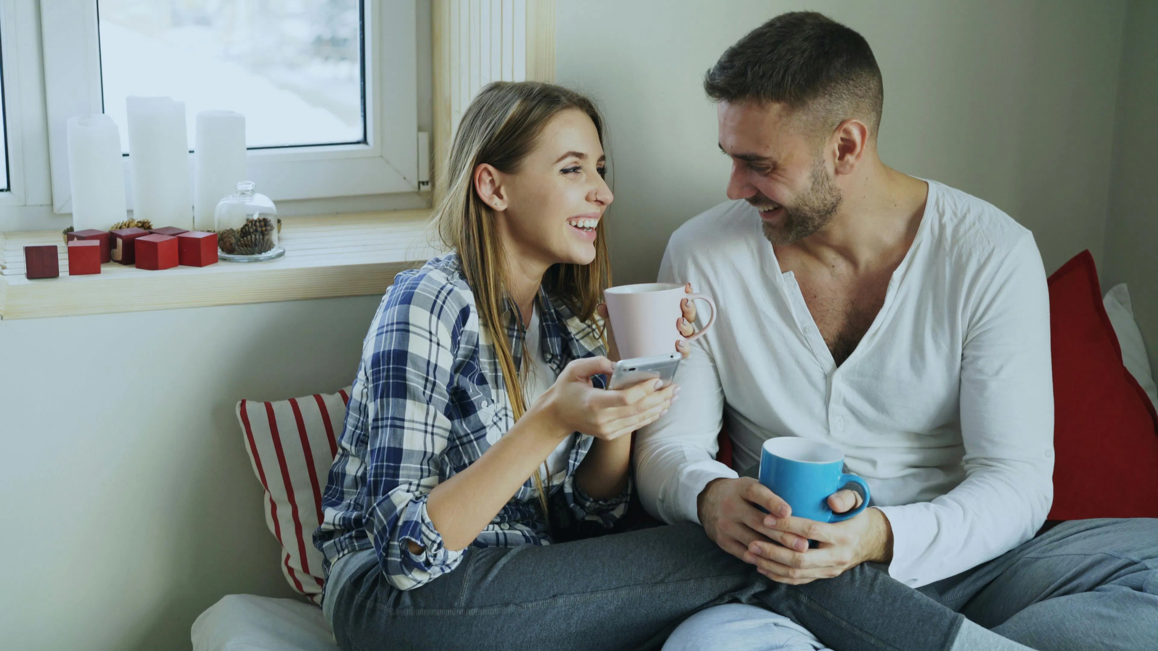 A couple sitting on the couch together
