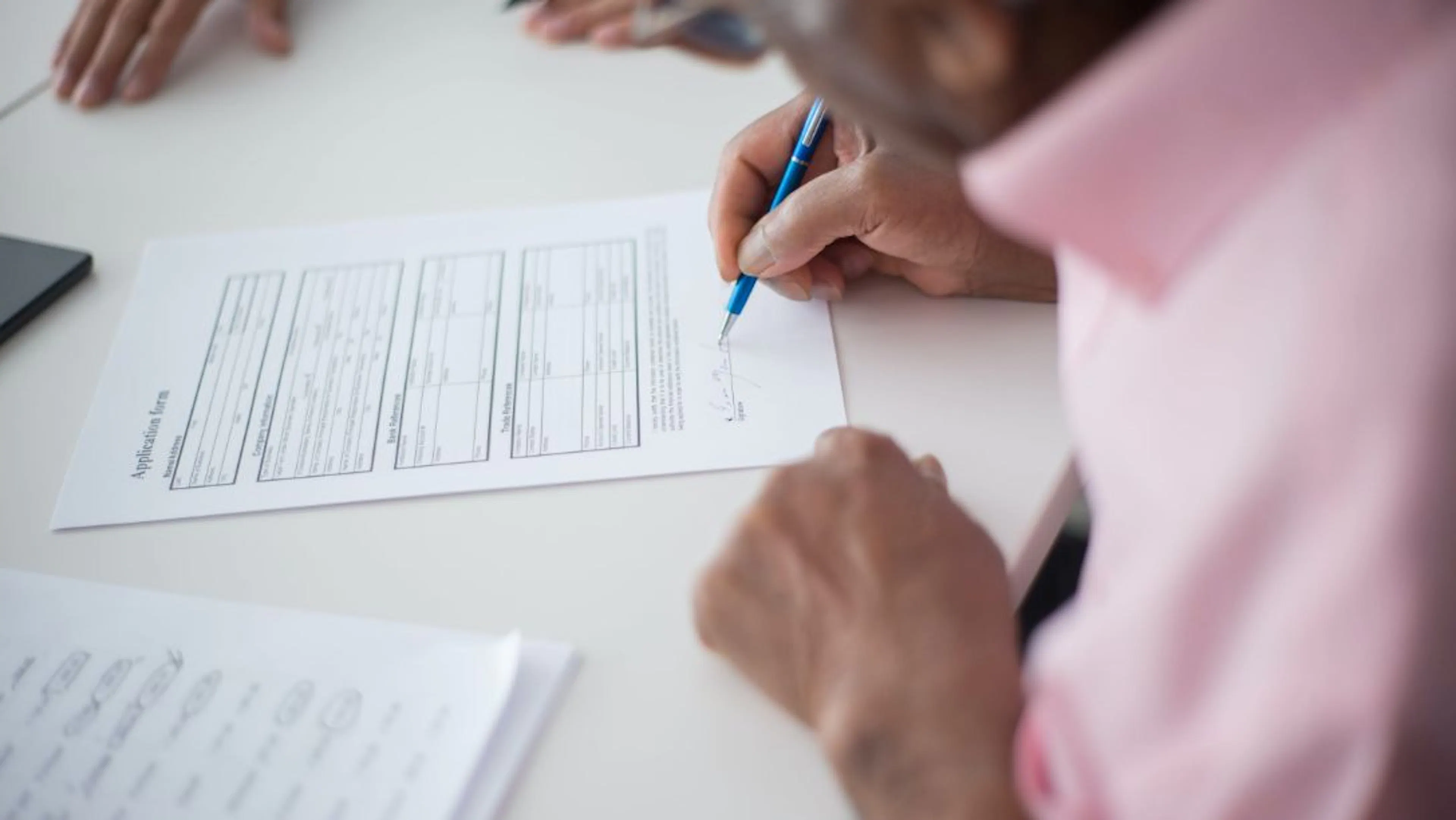 A person signing a contact