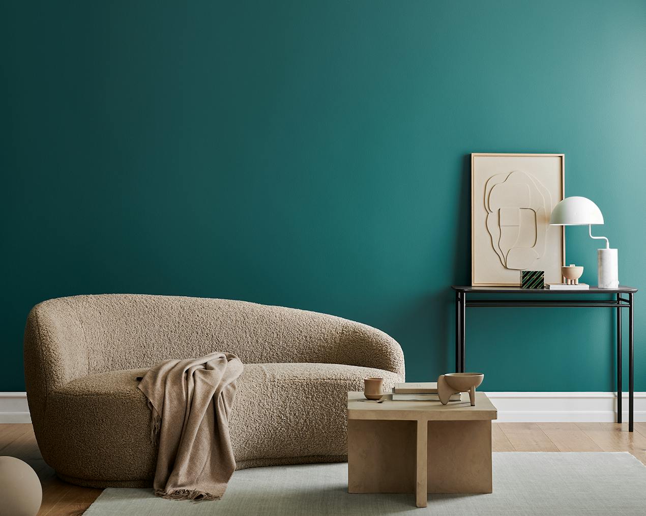 teal living room wall with white skirting boards 