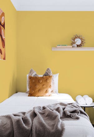 Lively yellow bedroom walls 