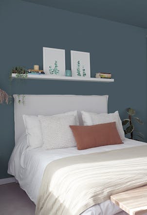 Bedroom painted with a blue shade