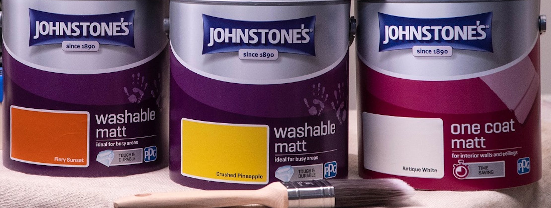front view of johnstone's paint tins