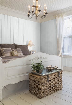 Bedroom painted with a light grey paint colour