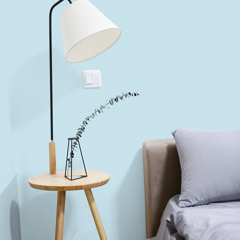 Bedroom painted in light blue paint