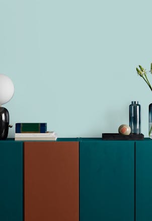 Sideboard with a wall painted in Veridian Green