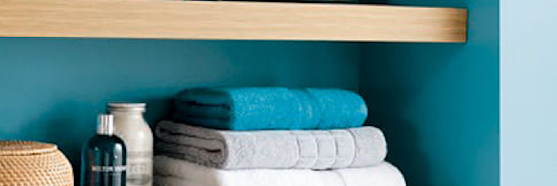 blue alcove shelf with towels 