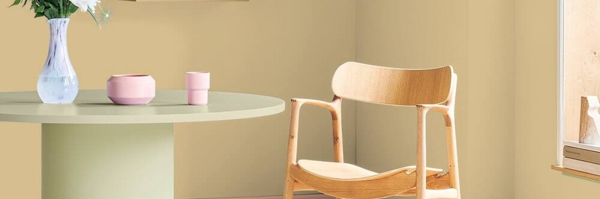 Yellow dining room painted with a muted hue