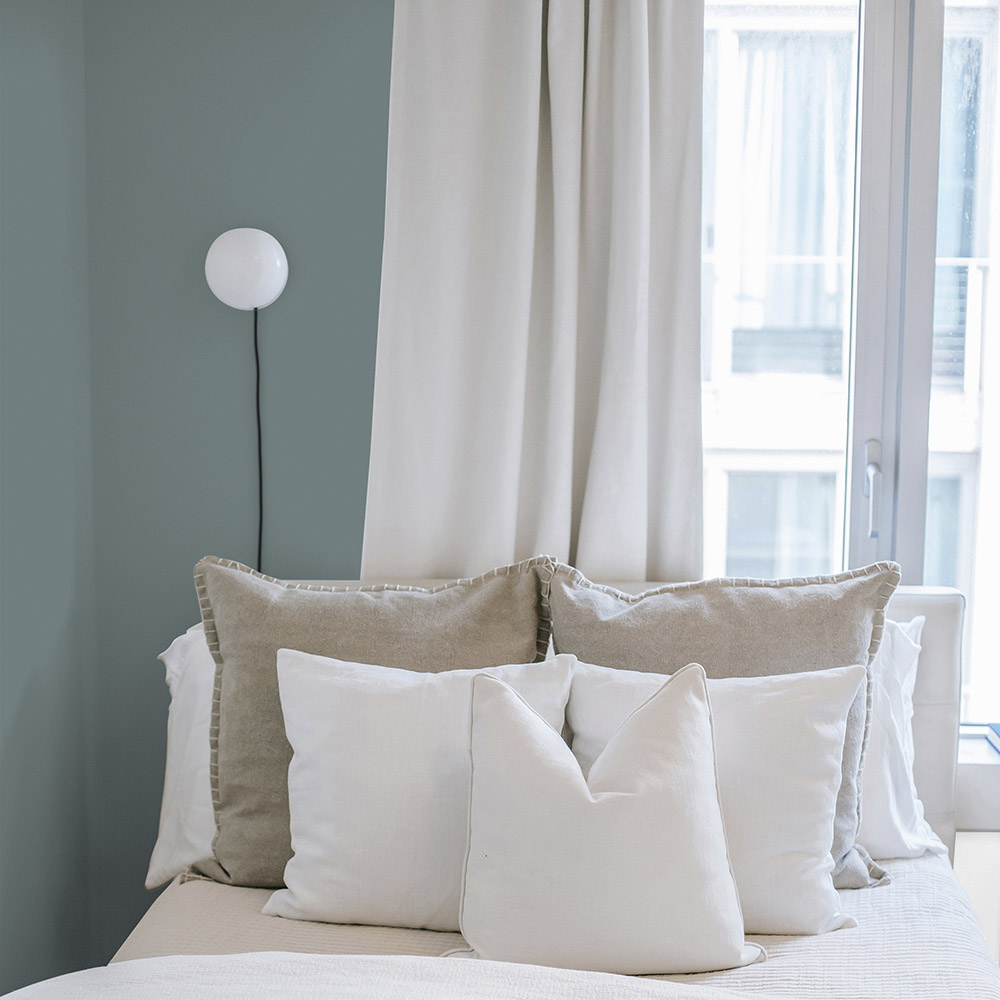 Bedroom painted with a soft grey 