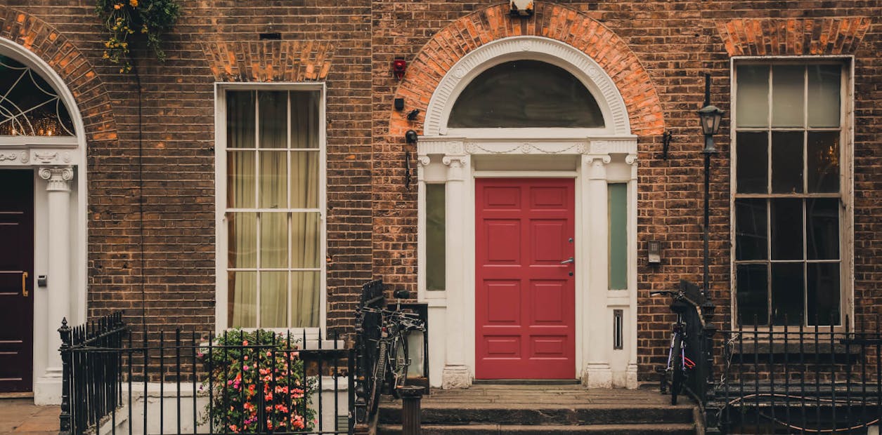 A front door with a deep red appearance will create a welcoming look.