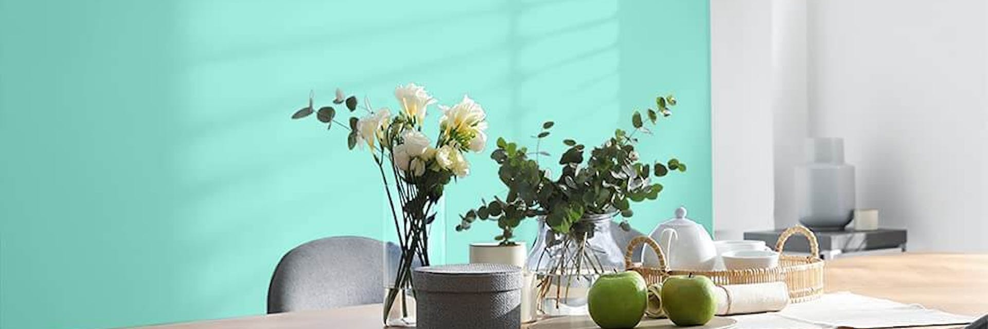 Lively mint green accent wall in a dining room