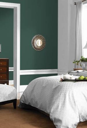 Bedroom painted with our midnight clover green