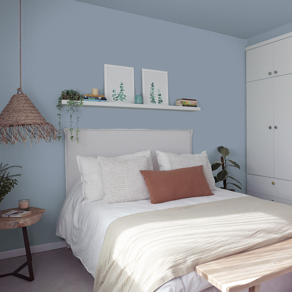 Bedroom painted with a modern blue shade