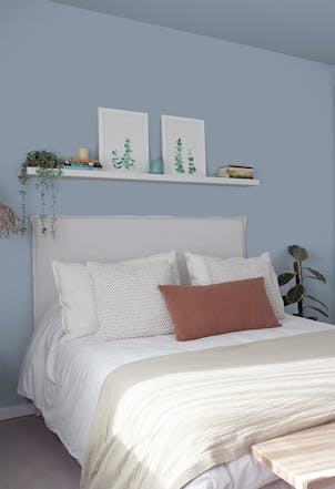Bedroom painted with a modern blue shade