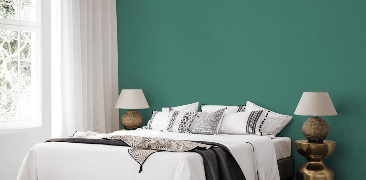 Bedroom painted with Johnstone's Evening Emerald and Peregrine