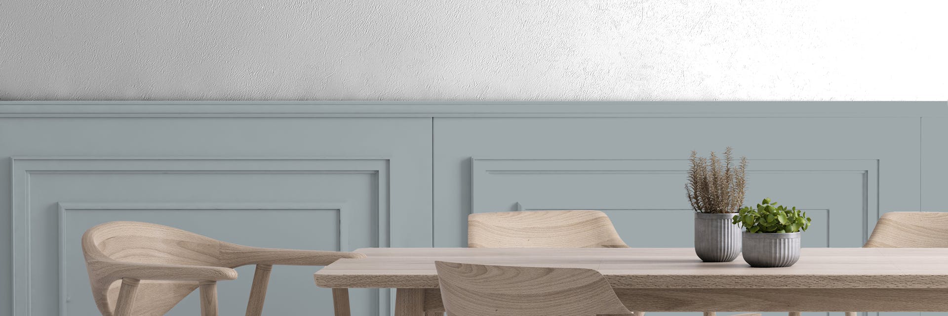 Dining room with a panelled wall.