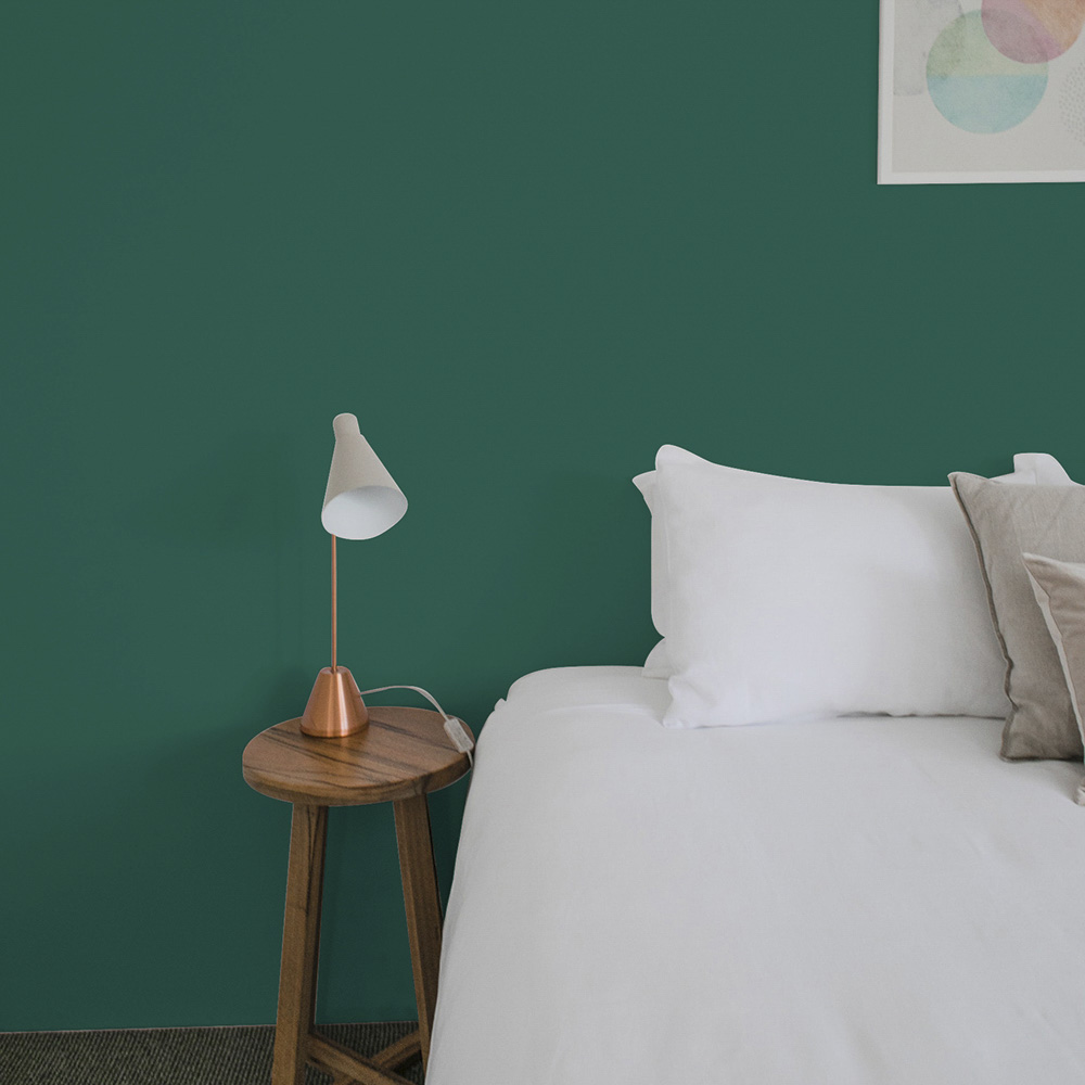 teal bedroom wall painted with Empress Teal