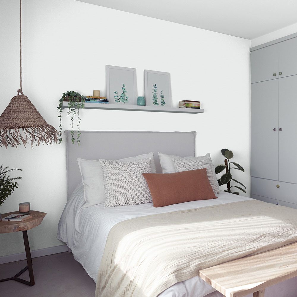 Bedroom painted with a pale grey paint