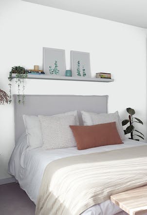 Bedroom painted with a pale grey paint