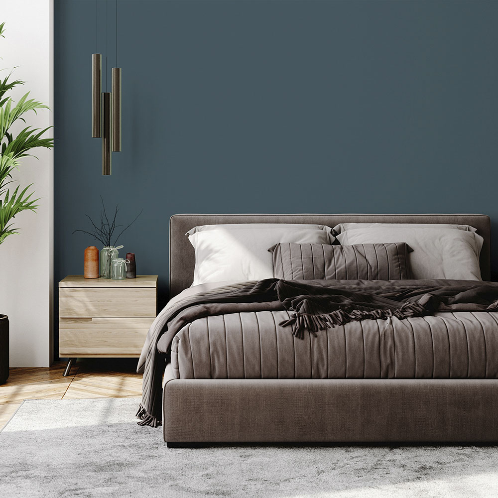 Bedroom painted with a mid-grey/blue paint colour