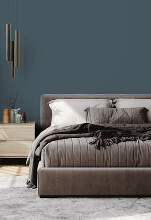Bedroom painted with a mid-grey/blue paint colour