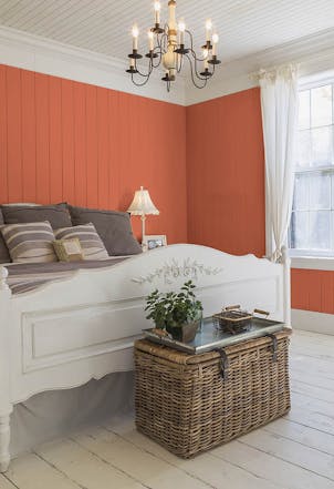 Vibrant orange bedroom wall 
