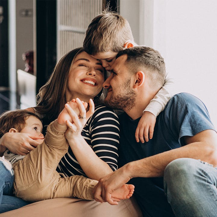 family hugging and smiling