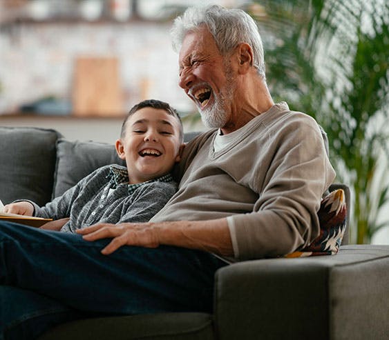 grandfather and grandson laughing