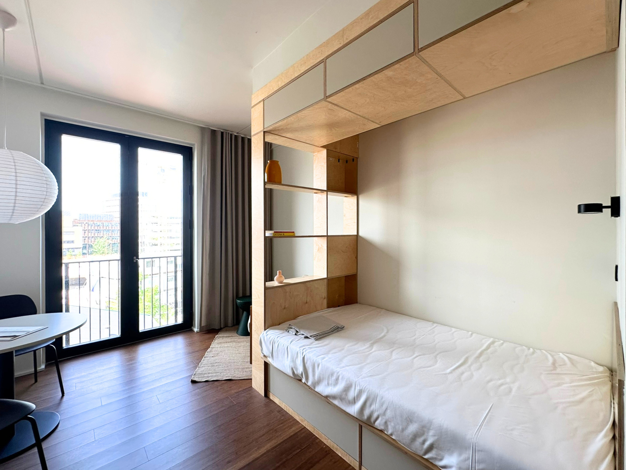 Bed in Norden studio apartment by LifeX