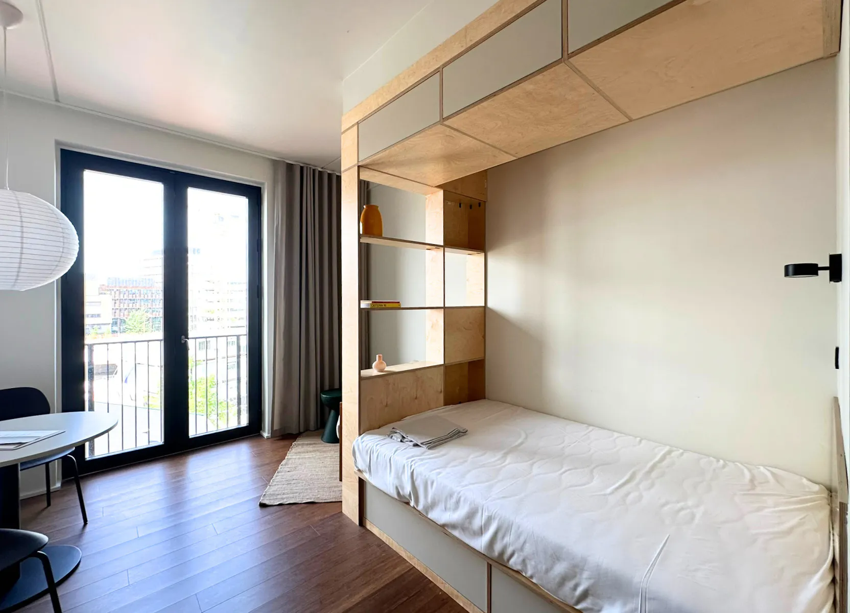 Bed in Norden studio apartment by LifeX