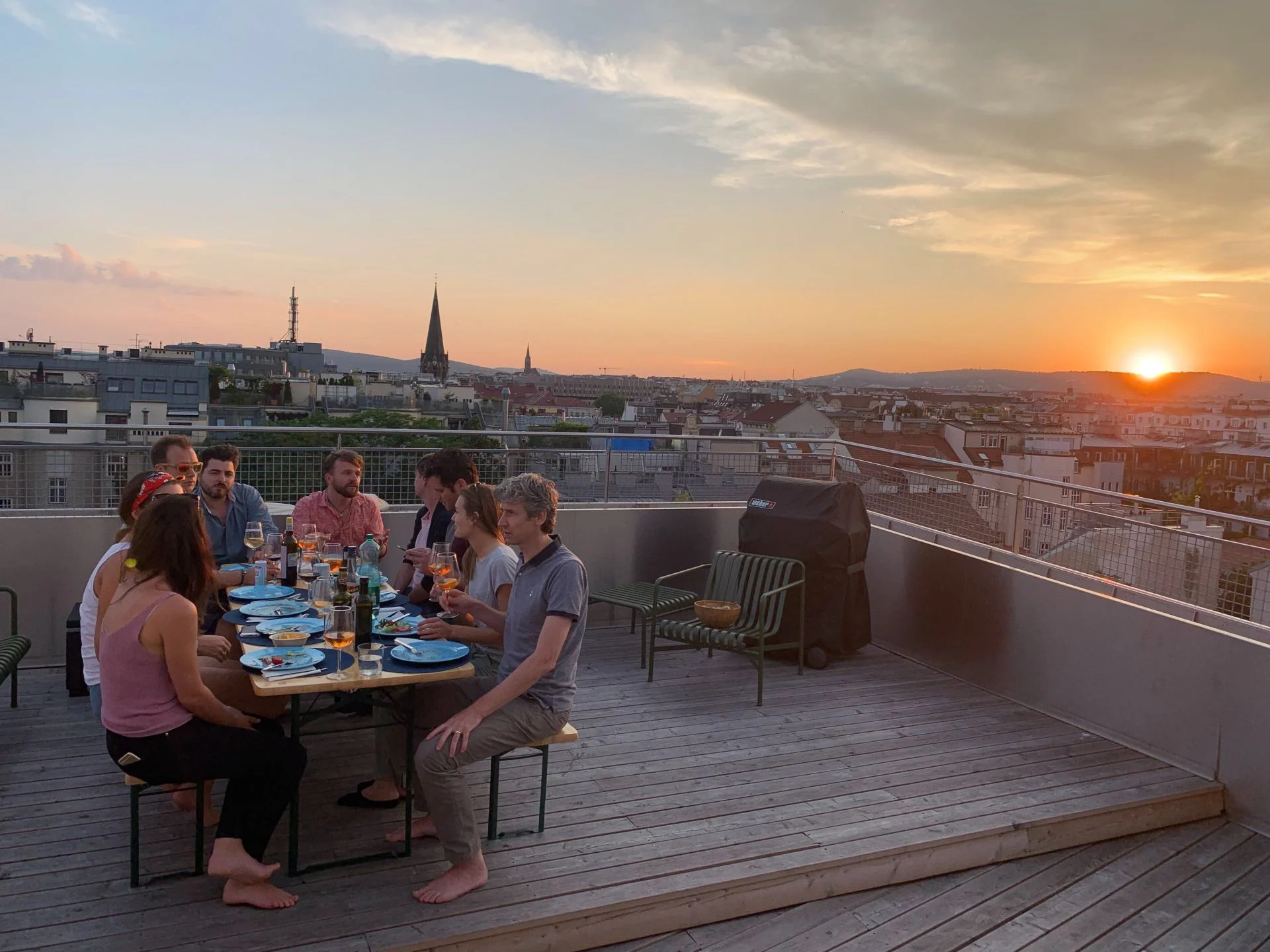 Shared dinner on the rooftop terrace of a LifeX coliving apartment