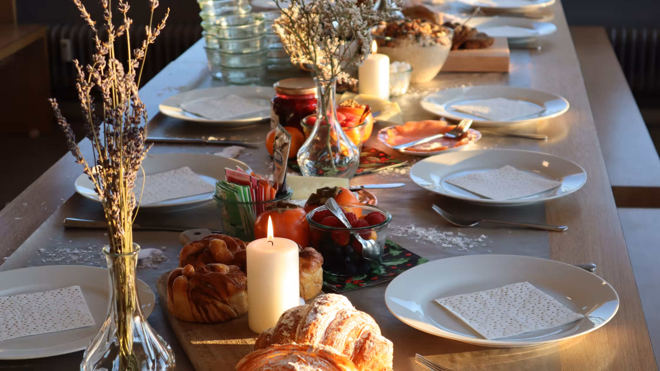 Prepared dinner table with cozy decoration and candles