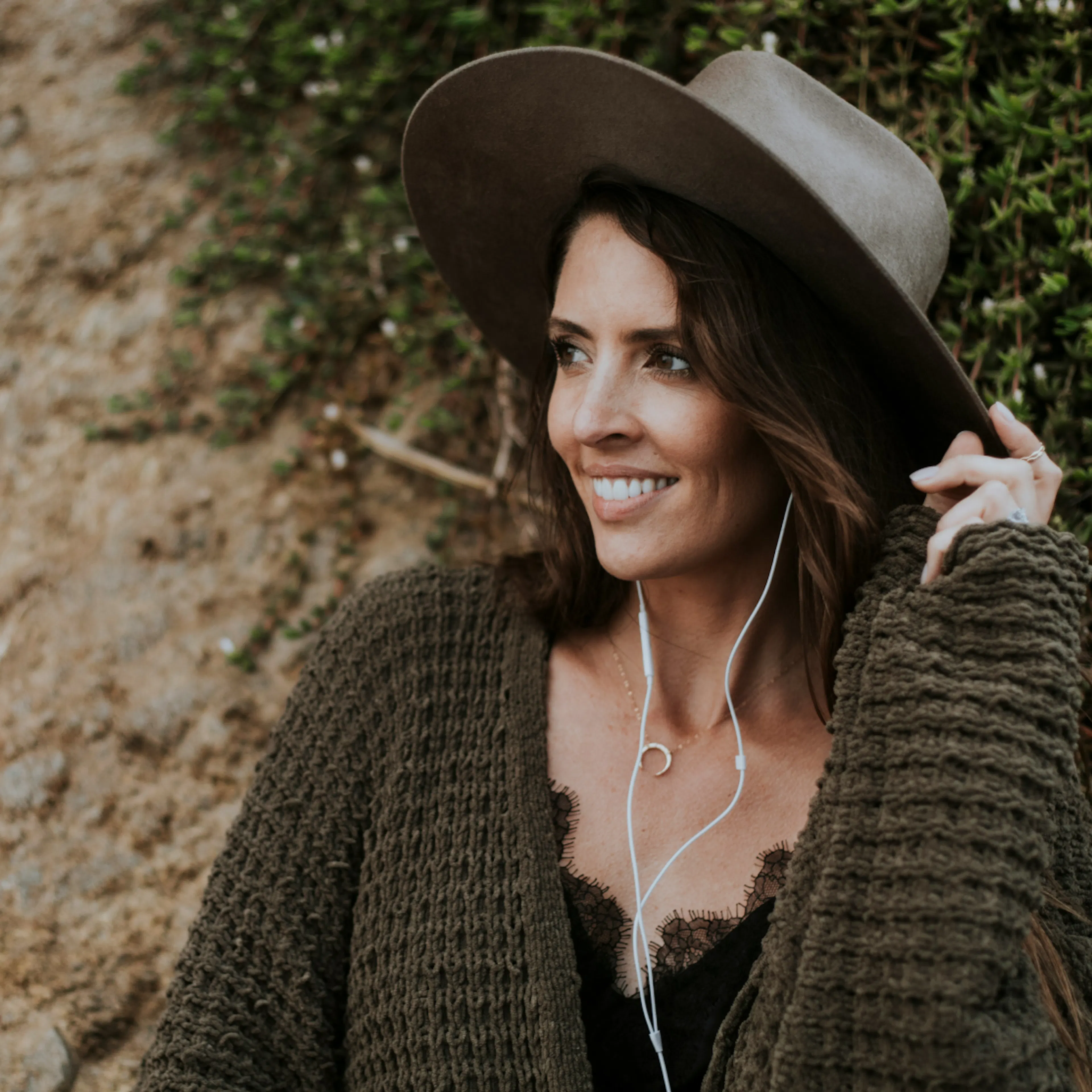 Woman in hat, looking off to the side