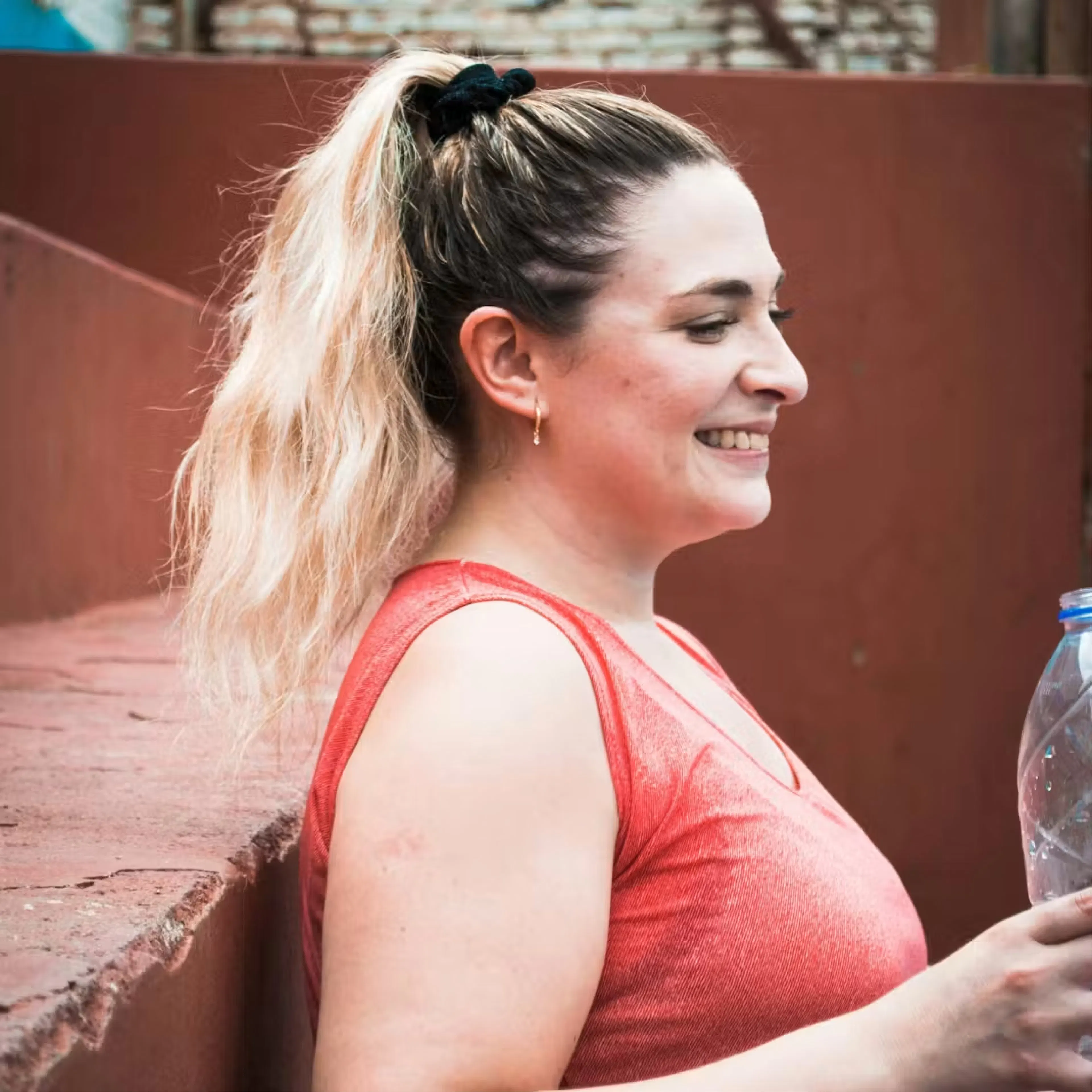 Smiling woman with blonde high ponytail